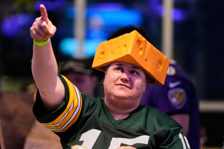 The cheesehead hat is a sunny nod to America's 'Hold my beer' exuberance